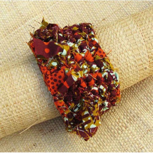 Manchette en wax orange, aubergine, moutarde et blanc avec franges