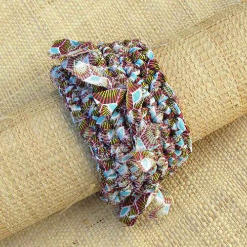 Manchette en wax rose fonc&eacute;, jaune, gris, turquoise et blanc avec franges