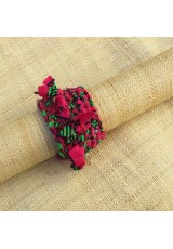 Manchette en wax rose, vert et noir avec franges